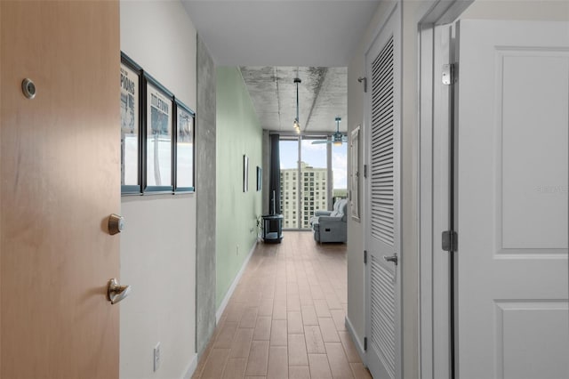 hall with light hardwood / wood-style flooring