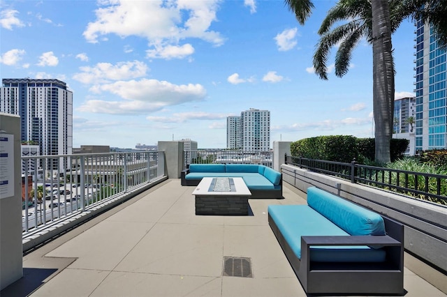 view of patio / terrace featuring an outdoor living space with a fire pit