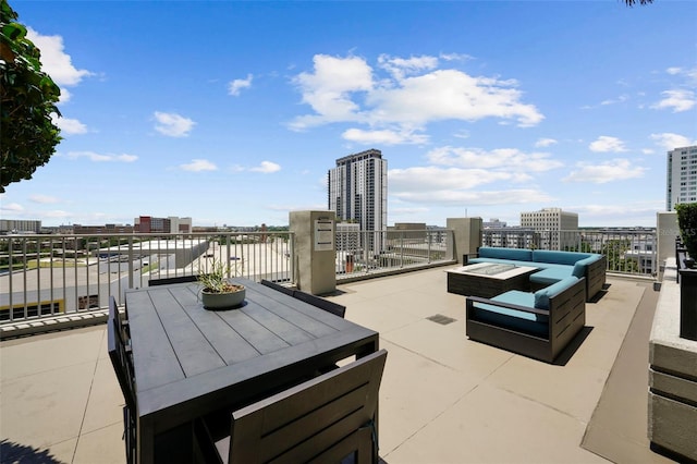 view of patio / terrace with an outdoor living space and a balcony