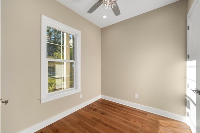 spare room featuring hardwood / wood-style floors, plenty of natural light, and ceiling fan