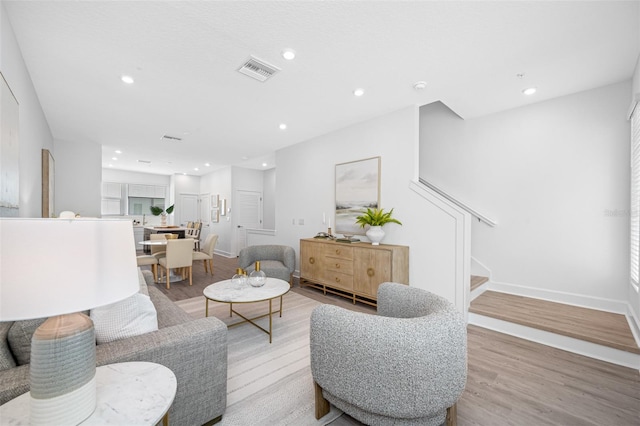 living room with light hardwood / wood-style floors