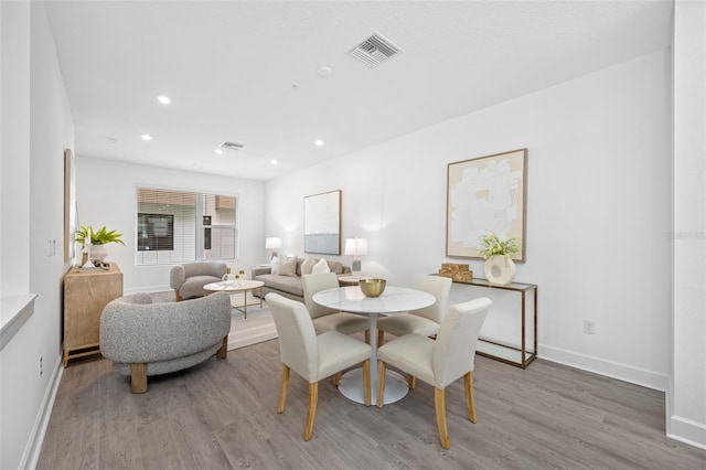 dining room with light wood-type flooring