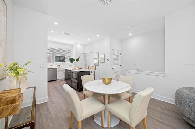 dining room featuring light hardwood / wood-style flooring