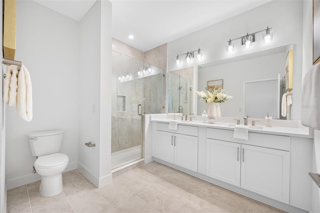 bathroom with tile patterned floors, vanity, an enclosed shower, and toilet