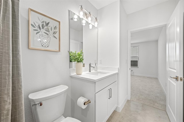 bathroom with vanity and toilet