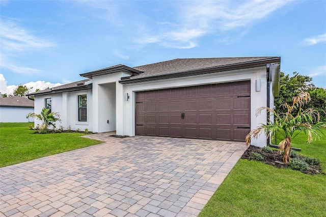 view of front of property featuring a garage and a front yard