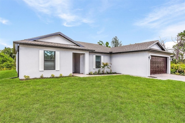 ranch-style home with a garage and a front yard