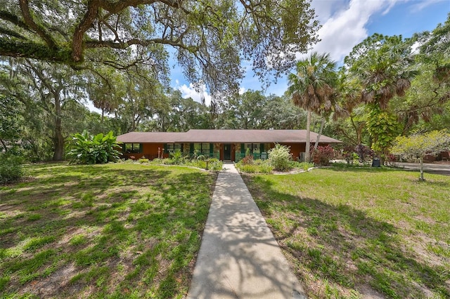 single story home with a front yard