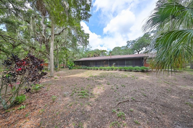 view of yard with a sunroom