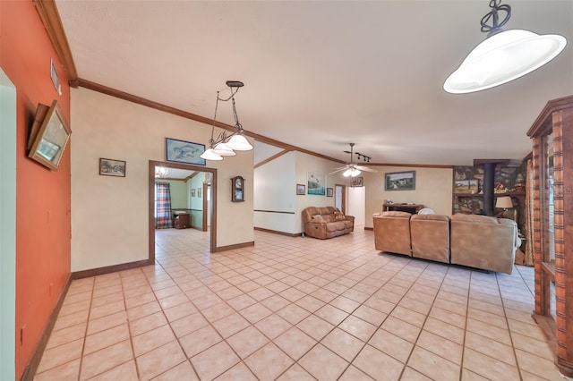 unfurnished living room featuring ornamental molding, a wood stove, light tile patterned floors, and ceiling fan