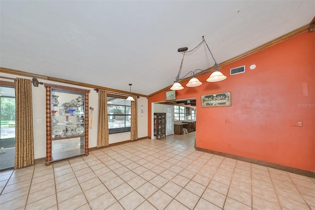 interior space with lofted ceiling, hanging light fixtures, and crown molding