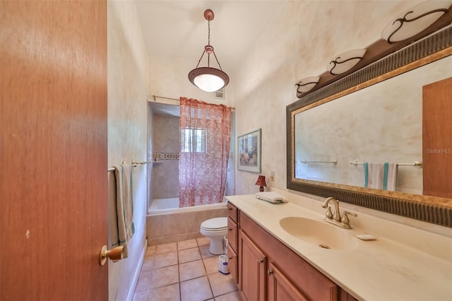 full bathroom featuring vanity, tile patterned floors, toilet, and shower / bath combo with shower curtain