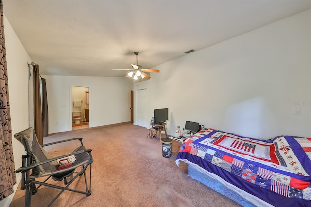 carpeted bedroom featuring connected bathroom and ceiling fan