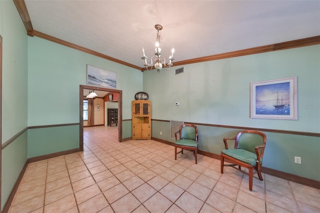 unfurnished room featuring crown molding, light tile patterned flooring, and a notable chandelier