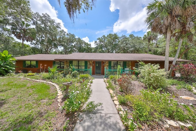 single story home featuring a porch