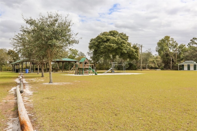 view of property's community featuring a yard and a playground