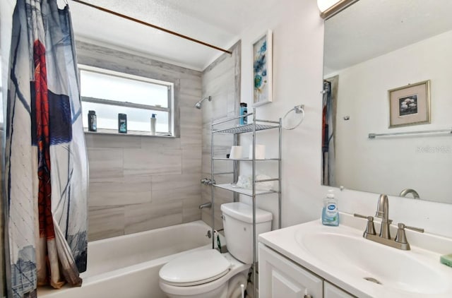 full bathroom featuring vanity, tiled shower / bath combo, and toilet