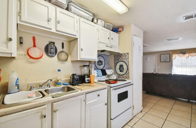 kitchen with sink, white cabinetry, white range with electric stovetop, and light tile patterned flooring