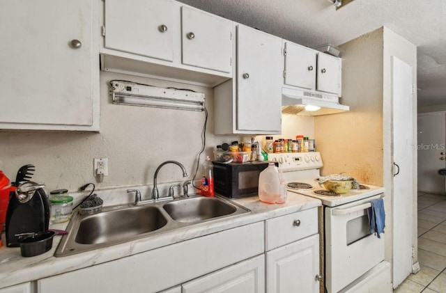 kitchen with light tile patterned flooring, white cabinetry, white electric stove, and sink