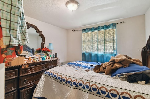 bedroom featuring a textured ceiling