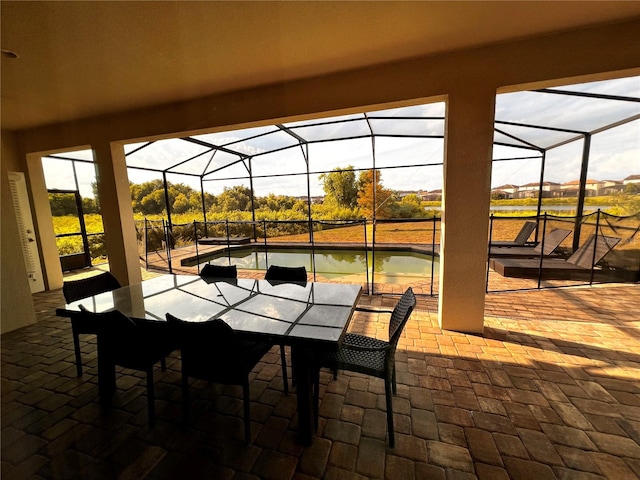 view of patio / terrace featuring glass enclosure