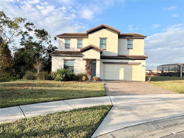 view of front of home featuring a front yard and a garage