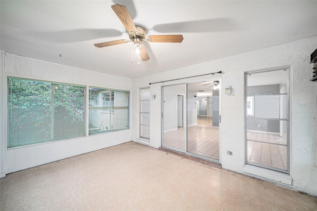 unfurnished room featuring ceiling fan