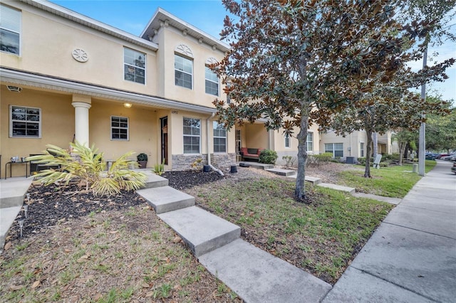 view of property featuring a front yard