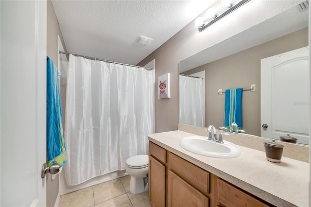 full bathroom featuring vanity, shower / bath combination with curtain, tile patterned flooring, toilet, and a textured ceiling