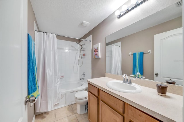 full bathroom with vanity, tile patterned floors, toilet, shower / bath combo with shower curtain, and a textured ceiling