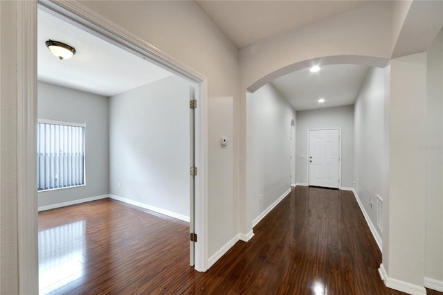 corridor featuring dark wood-type flooring