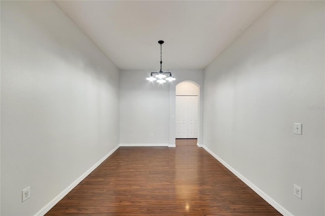 unfurnished room featuring dark hardwood / wood-style flooring