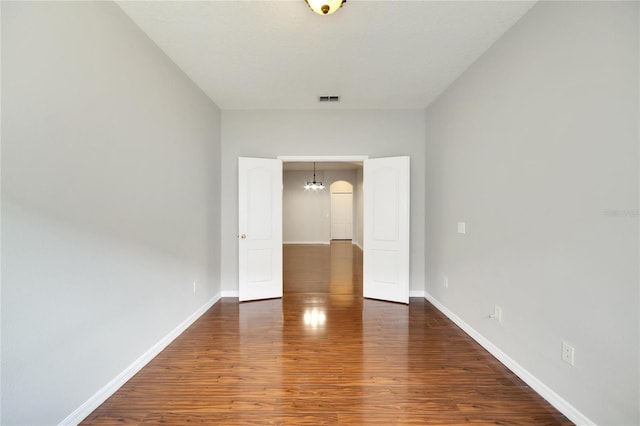 spare room featuring dark hardwood / wood-style floors