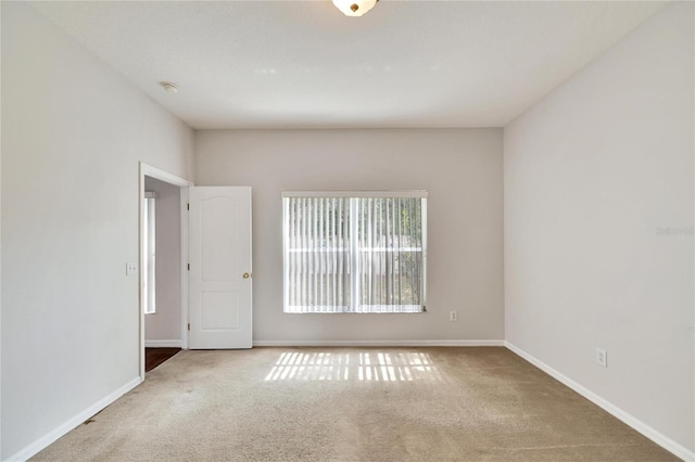 unfurnished room featuring carpet floors