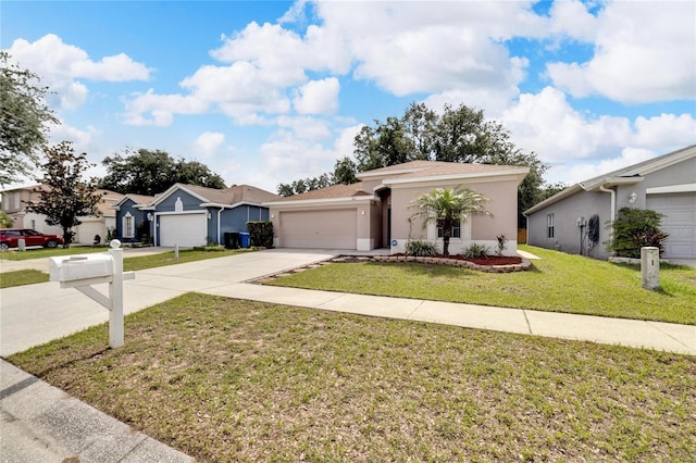 ranch-style house featuring a garage and a front lawn