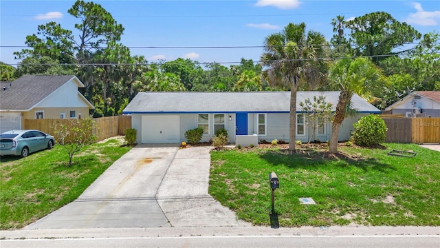 ranch-style home featuring a garage and a front yard