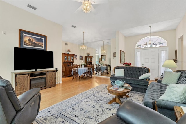 living room with hardwood / wood-style flooring and a chandelier