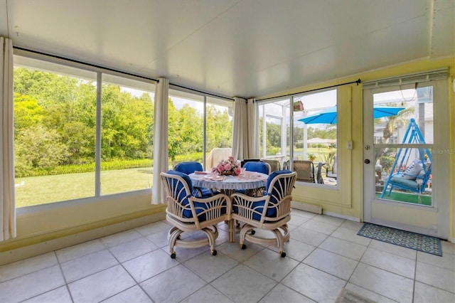 sunroom / solarium featuring a healthy amount of sunlight