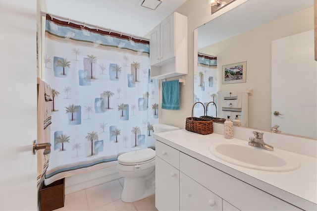 bathroom featuring tile patterned floors, vanity, and toilet