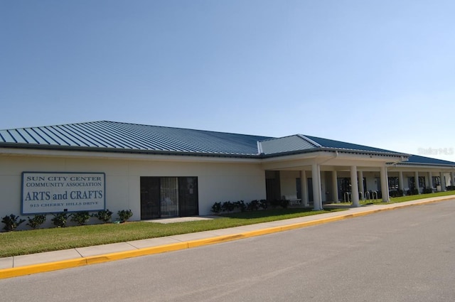 view of front facade featuring a standing seam roof and metal roof