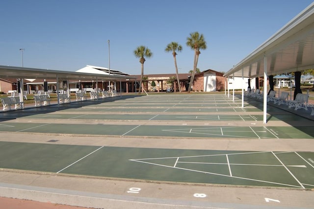 view of home's community featuring shuffleboard