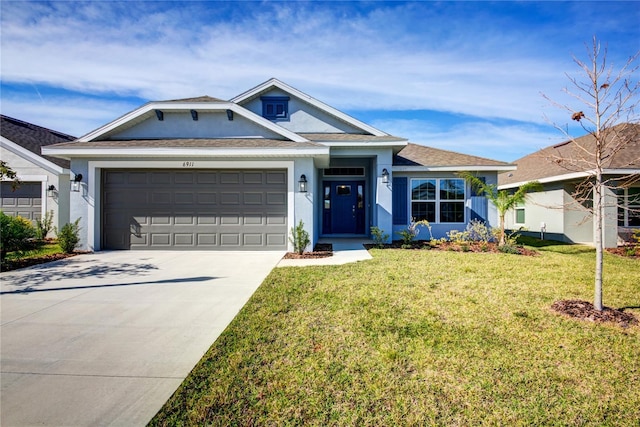 view of front of house with a front lawn and a garage