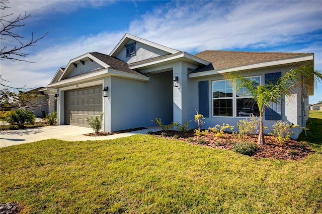 view of front of property with a garage and a front lawn