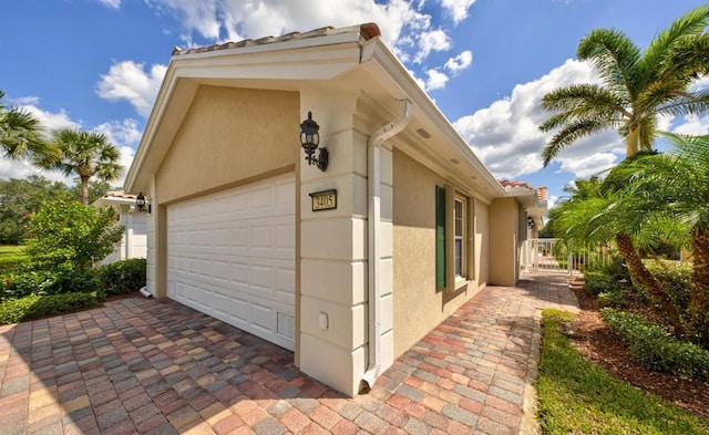 view of property exterior featuring a garage