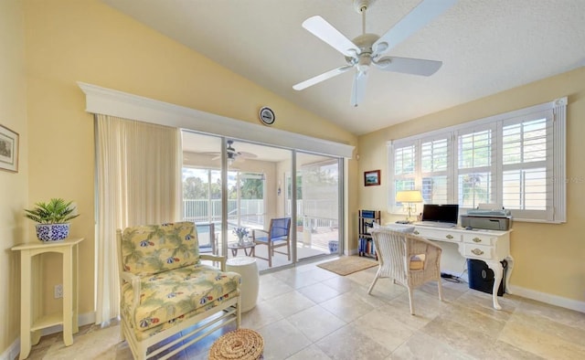 home office with vaulted ceiling and ceiling fan