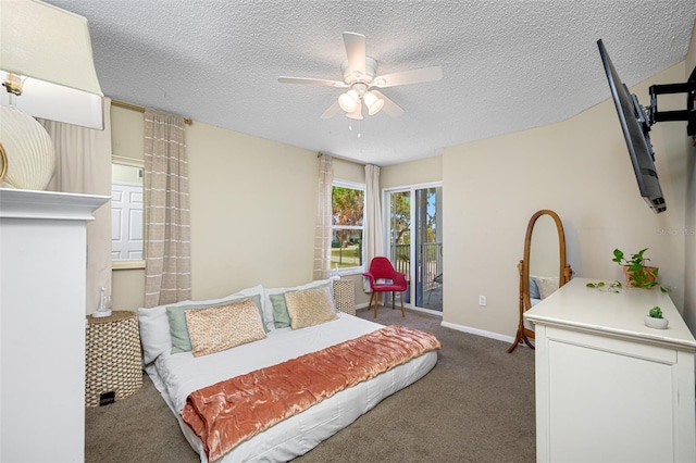 bedroom featuring a textured ceiling, ceiling fan, and carpet flooring