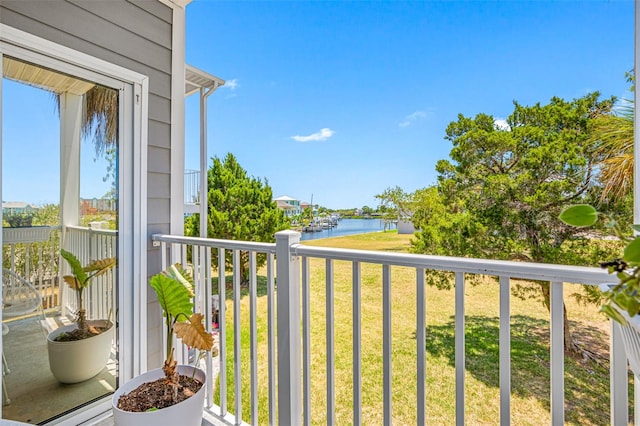 balcony featuring a water view