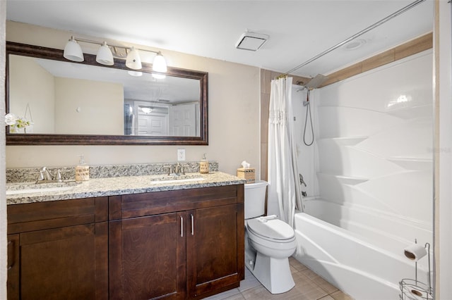 full bathroom with tile patterned flooring, toilet, shower / tub combo with curtain, and vanity