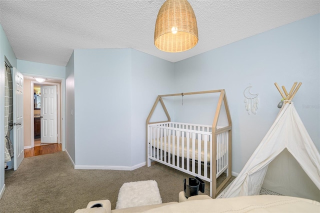 bedroom featuring a textured ceiling and hardwood / wood-style flooring