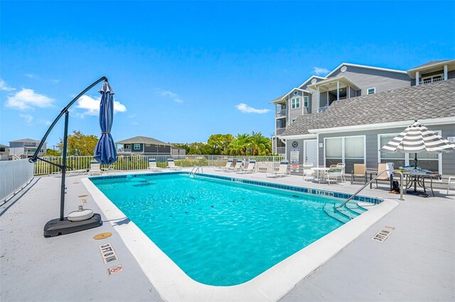 view of swimming pool featuring a patio area